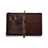 The A4 Leather Compendium ACE by Vintage Leather Sydney features multiple compartments: zippered pockets, card slots, pen loops, a clear ID window on the left, and an empty suede panel on the right—perfect as a sleek business organizer.