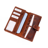 A brown leather wallet-style phone case shown open on a white background, with card slots, a light blue phone partially inserted, and printed card inserts visible inside.