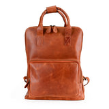 The Bolton Leather Backpack – Tan Brown by Vintage Leather Sydney features a top handle, front zippered pocket, and sturdy shoulder straps—offering style, durability, and everyday convenience. Shown against a white background.