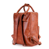 The Bolton Leather Backpack – Tan Brown by Vintage Leather Sydney features adjustable shoulder straps, a top handle, and a zippered side pocket—a stylish way to carry your essentials, shown here on a white background.