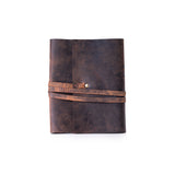 The Leather A5 Notebook Cover Cambridge by Vintage Leather Sydney is shown in brown full-grain leather with a distressed finish, wraparound strap, and metal button closure, photographed against a white background.