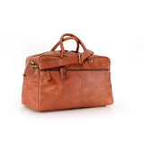 The Leather Duffle Bag Regent by Vintage Leather Sydney features brown leather, a front zipper pocket, two handles, and a detachable shoulder strap, shown against a white background.