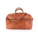 The Leather Duffle Bag Regent by Vintage Leather Sydney is a large brown leather bag with gold-tone hardware, a front zip pocket, two top handles, and an adjustable shoulder strap, shown against a plain white background.