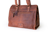 The Leather Handbag Fennel by Vintage Leather Sydney is a brown leather tote with two handles, a front zippered pocket, leather tag, stitched logo patch near the base, and a rustic handcrafted look.