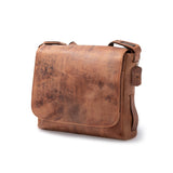 A brown Leather Satchel - Branco by Vintage Leather featuring a flap closure, adjustable shoulder strap, and small leather tag on the strap, displayed against a plain white background.