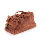 The Leather Duffle Bag Berlin by Vintage Leather Sydney, in brown leather with handles, shoulder strap, and gold-toned hardware, is displayed on a white background.