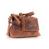 The Leather Duffle Bag Tokyo by Vintage Leather Sydney is a large brown leather bag with a front zip pocket, adjustable shoulder strap, and carrying handles, shown on a white background.