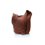 The Vintage Leather Tote Bag Havana is a brown leather women's handbag with a wide adjustable strap and metal buckle, shown upright on a white background.