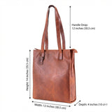 The Leather Tote Bag Luna by Vintage Leather Sydney is a brown leather tote with two long handles. Dimensions: 14" high, 12" wide, 4" deep, and a 12" handle drop—ideal for daily use.