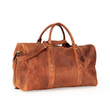 A brown distressed leather duffel bag with dual top handles and a detachable shoulder strap, shown on a plain white background.