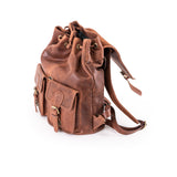Brown leather backpack on a white background