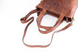 The Leather Work Tote Bag Parsley by Vintage Leather Sydney, shown on a white background, features brown leather, two short handles, and a long adjustable shoulder strap. Further product details are currently unavailable.