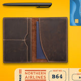 The Vintage Leather Passport Wallet - Perth, a blue credit card, black pen, and Northern Airlines boarding pass (seat B64) are neatly arranged on a bright yellow surface—ideal for organising your travel essentials.