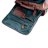 The Leather Travel Backpack Ryde by Vintage Leather Sydney is shown open, revealing a green fabric interior with multiple pockets, a zippered compartment, and an attached leather organizer—neatly arranged like top-tier web design.
