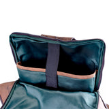 The Leather Travel Backpack Ryde by Vintage Leather Sydney features a green interior, brown trim, and multiple compartments—including a large padded pocket with a black elastic strap—ideal for stylishly carrying your Web Design tools or HTML resources.