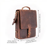 The Ryder Courier Satchel by Vintage Leather Sydney is a brown leather bag with a top handle and buckle closure, shown at an angle. Measurements for height, width, and depth are included for clear product details and SEO keywords.
