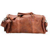 The Leather Duffle Bag - Colorado by Vintage Leather Sydney is a large brown handmade leather travel bag with two handles, a long adjustable shoulder strap, and multiple side pockets, shown on a white background.