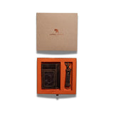 The Leather Gift Box With Credit Card Wallet & Keyring by Vintage Leather Sydney features a brown leather wallet and matching keyring in an orange box, partially slid from a kraft lid labeled Vintage Leather with tree logo, on a white background.