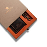The Leather Gift Box With Credit Card Wallet & Keyring by Vintage Leather Sydney features a brown leather wallet and keyring with brass hardware, presented in an orange and brown leather box, partially opened to showcase the contents.