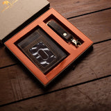 The Vintage Leather Sydney Leather Gift Box features a brown credit card wallet with transparent ID slot and a matching keyring, both elegantly presented in premium packaging.