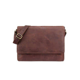 The Leather Laptop Bag - Kingston by Vintage Leather is a brown messenger bag with a front flap and adjustable shoulder strap, shown against a plain white background.