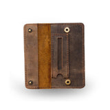 The Marco Pouch For Tobacco by Vintage Leather is a square, brown leather pouch with visible stitching, dual metal snaps, an open left pocket, and a right slot with a circular cutout—perfect for tobacco or accessories. Suede-like brown interior.