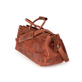 A brown distressed leather duffel bag with dual top handles and a detachable shoulder strap, shown on a plain white background.