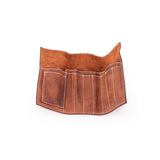 The Leather Artist Roll Zip by Vintage Leather Sydney is displayed open and empty, showing its multiple stitched pockets against a white background.