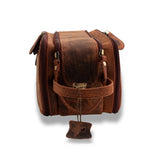 The Leather Travel Toiletry Bag Porter by Vintage Leather Sydney features two zippered compartments, a front pocket, and a leather pull tab, displayed from the front on a white background.