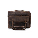 The Parker Leather Mens Briefcase by Vintage Leather Sydney, shown on a white background, features vintage leather, a top handle, front flap with two buckles, and a detachable shoulder strap—elevating your professional style.