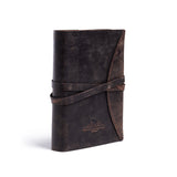 The Indigo Journal Leather by Vintage Leather is a dark brown, vintage-style buffalo leather journal with a wraparound strap closure, subtle embossed logo, upright on a white background, and offers personalisation options.