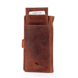 A brown textured leather credit card holder wallet with a strap closure and an embossed logo at the bottom, shown on a white background with a credit card partially inserted.