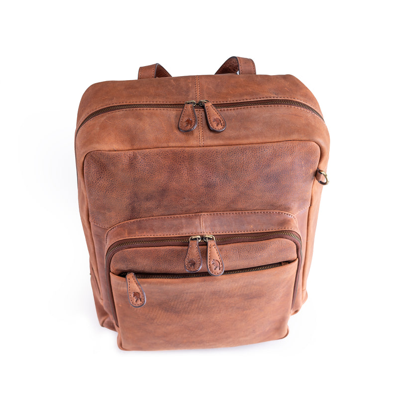 The Leather Work Backpack Burley by Vintage Leather Sydney features three zippered compartments, sturdy straps, and classic brown leather—offering style and practicality for daily use. Photographed on a white background.