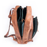 The Leather Work Backpack Burley by Vintage Leather Sydney, shown open from the side against a white background, features three main zippered compartments and a dark-lined interior—combining spacious design with stylish functionality.