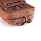 A close-up of the Leather Work Backpack Burley by Vintage Leather Sydney, featuring brown leather, multiple zippered compartments, and sturdy stitching against a white background to showcase its premium craftsmanship.