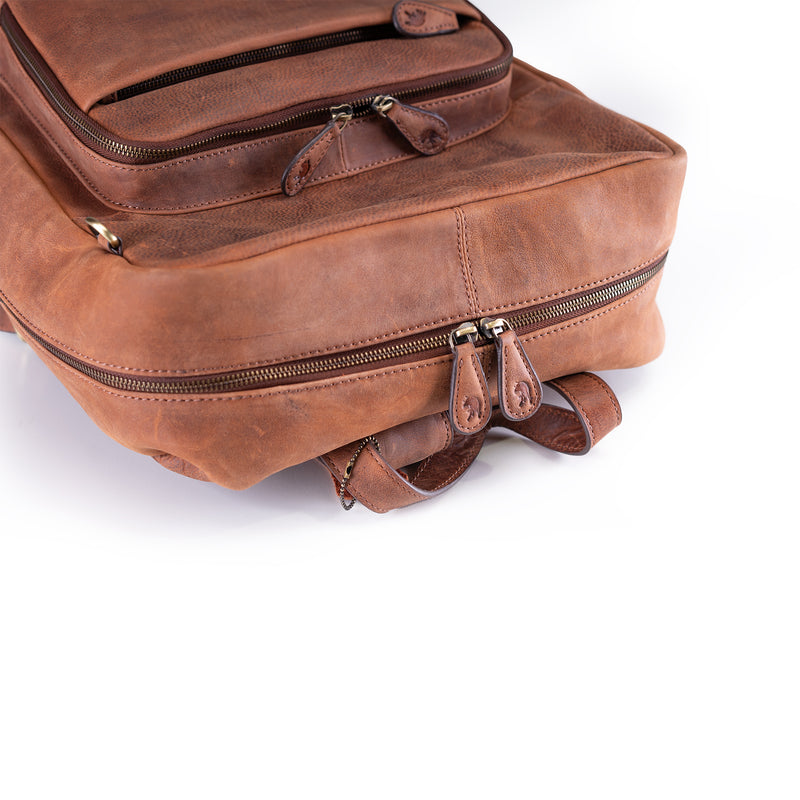 A close-up of the Leather Work Backpack Burley by Vintage Leather Sydney, featuring brown leather, multiple zippered compartments, and sturdy stitching against a white background to showcase its premium craftsmanship.