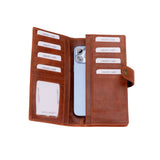 A brown leather card holder wallet shown open, containing multiple card slots, an ID window, and a light blue smartphone, photographed on a solid white background.