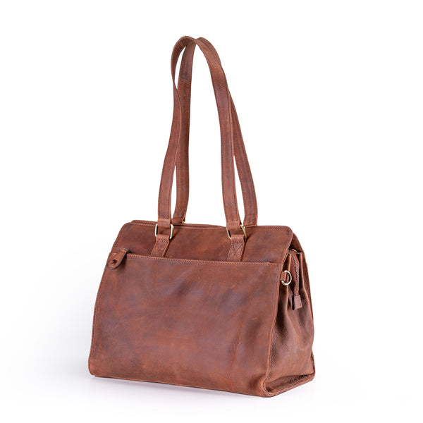 The Leather Handbag Fennel by Vintage Leather Sydney features a brown leather build, two long shoulder straps, a spacious main compartment, and an elegant design—photographed against a white background.