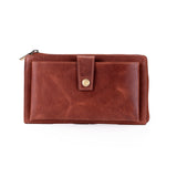A brown leather zip-around wallet with a front flap pocket and a gold snap button, shown on a plain white background.