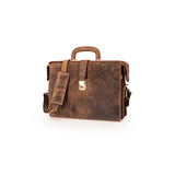 A distressed brown leather briefcase with a top handle, adjustable shoulder strap, and a silver-toned padlock closure, shown on a plain white background.