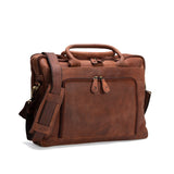 The Vintage Leather Laptop Bag Sentosa, featuring a padded handle, adjustable shoulder strap, and front zippered pocket, is displayed against a white background.