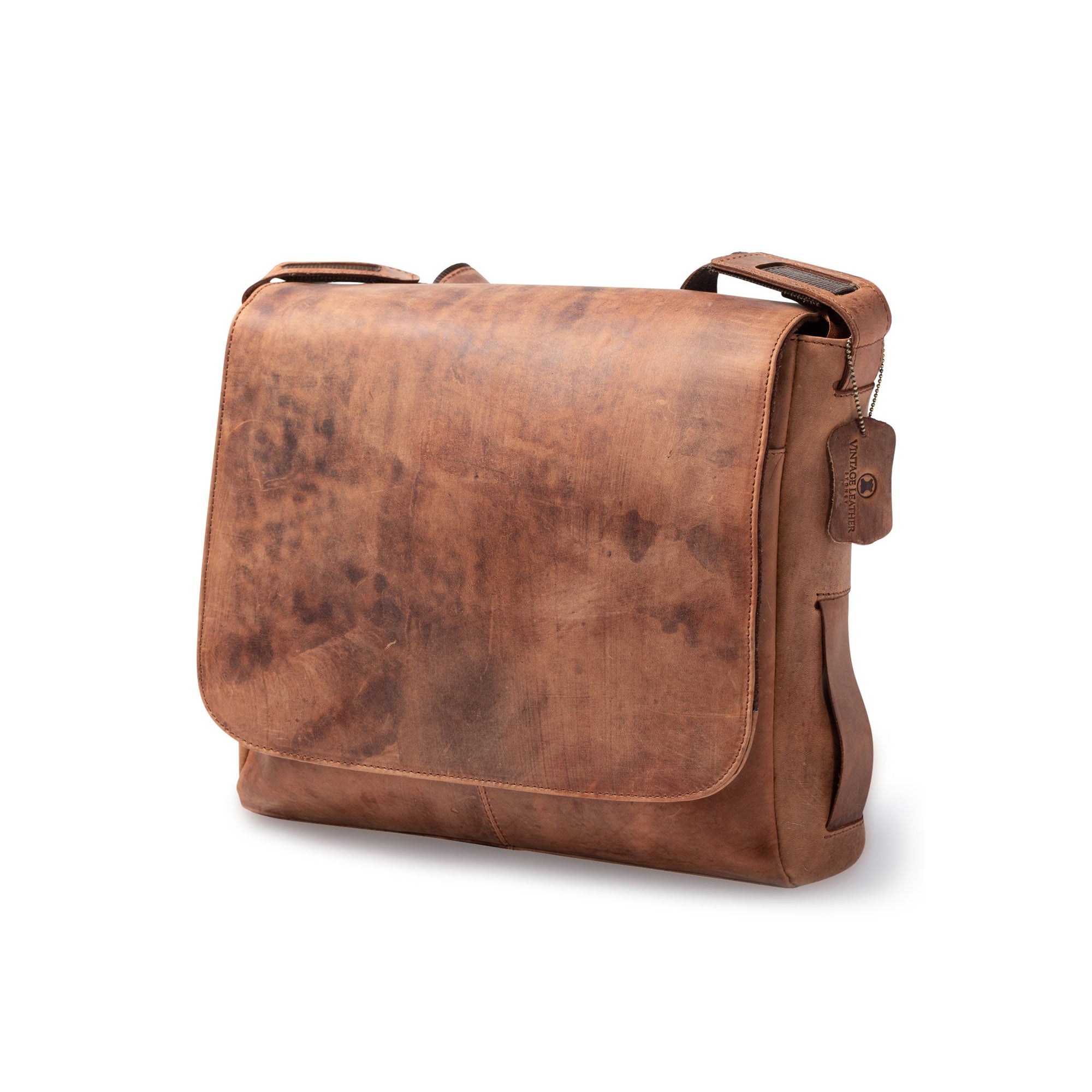 A brown Leather Satchel - Branco by Vintage Leather featuring a flap closure, adjustable shoulder strap, and small leather tag on the strap, displayed against a plain white background.