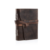 The Leather Bound Journal Basil by Vintage Leather Sydney is a closed, rustic brown handmade journal with a wraparound strap and visible white spine stitching, shown standing upright on a white background.