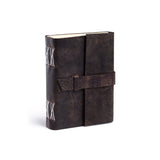 The Vintage Leather Echo is a dark brown leather bound journal with white spine stitching and a wraparound strap closure—perfect for capturing travel adventures.