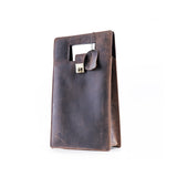 The Vintage Leather Sydney Leather Wine Carry Bag Sudbury, featuring a brown leather finish, rectangular handle cutout, metal latch closure, and leather tag, is ideal for gifting or stylishly carrying your favorite bottle. Photographed on a white background.