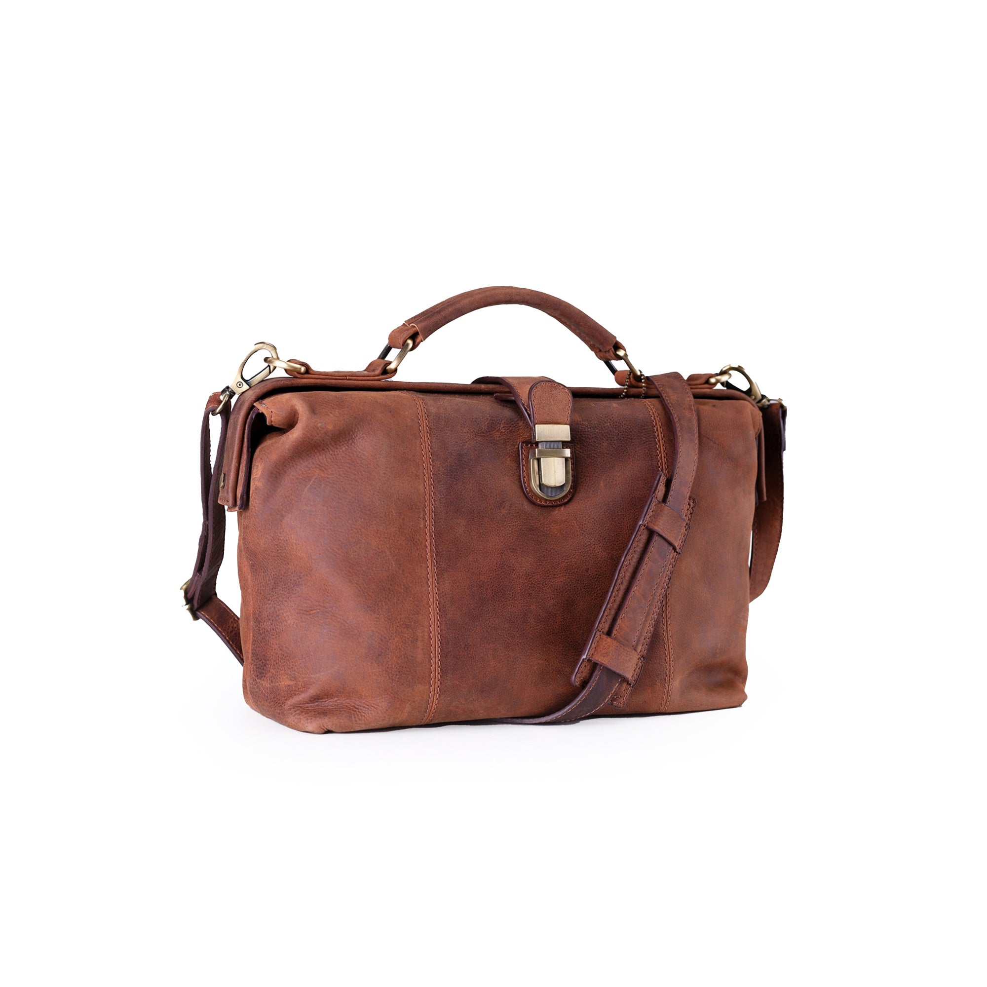 The Leather Handbag Sage by Vintage Leather features a brown leather design with a top handle, adjustable shoulder strap, and brass buckle closure, shown against a white background.