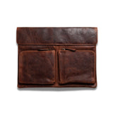 The Vintage Leather Davenport Leather Laptop Sleeve for MacBook Pro 14 inch features full-grain brown leather, two front zip pockets, and a flap closure—ideal for stylish laptop protection. Shown against a white background.