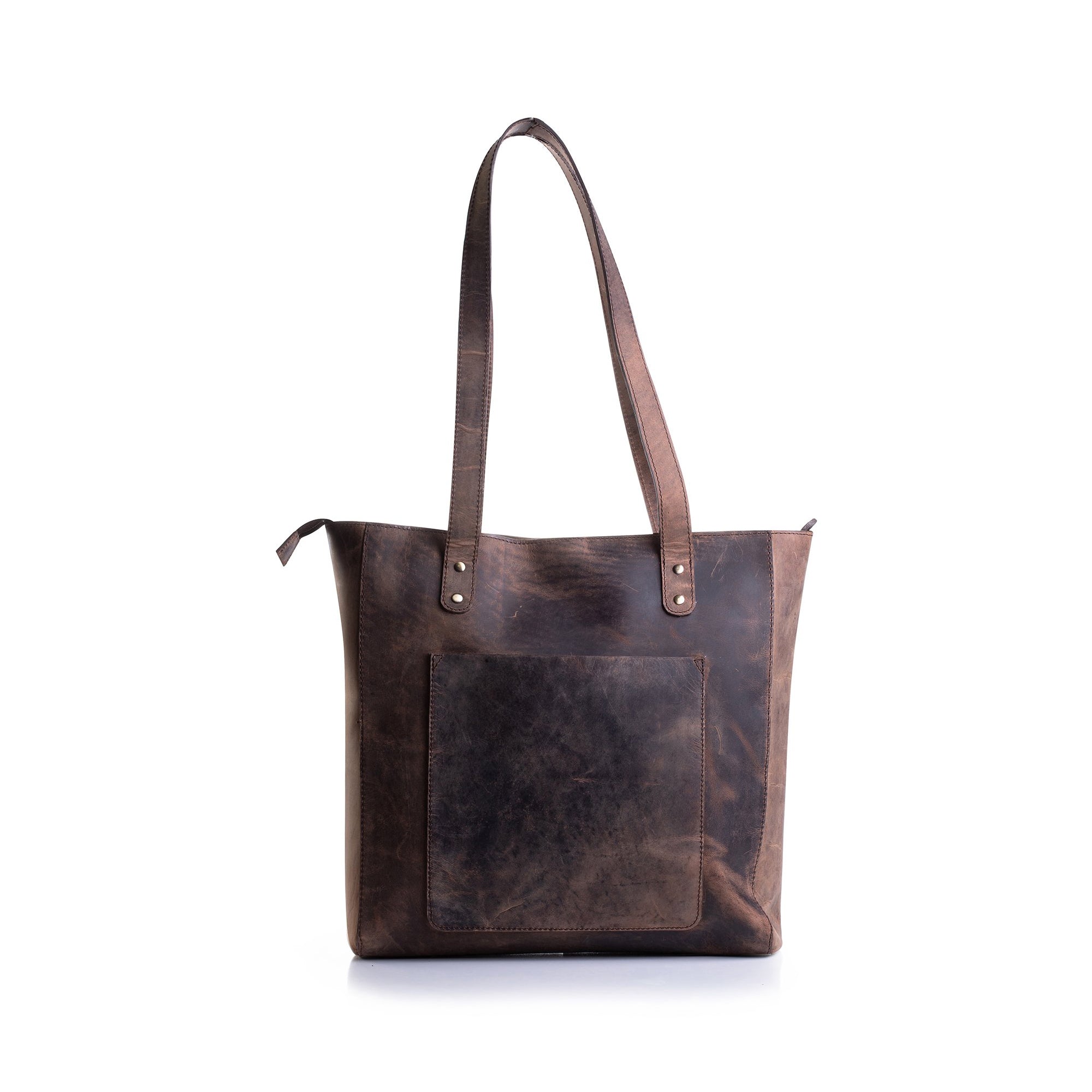The Leather Tote ARIA by Vintage Leather features two shoulder straps, a zip closure, and a spacious front pocket, shown against a white background.
