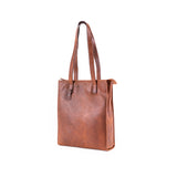 The Leather Tote Bag Luna by Vintage Leather Sydney is a brown minimalist handbag with a smooth texture and two long shoulder straps, standing upright on a white background. No visible brand markings are present.