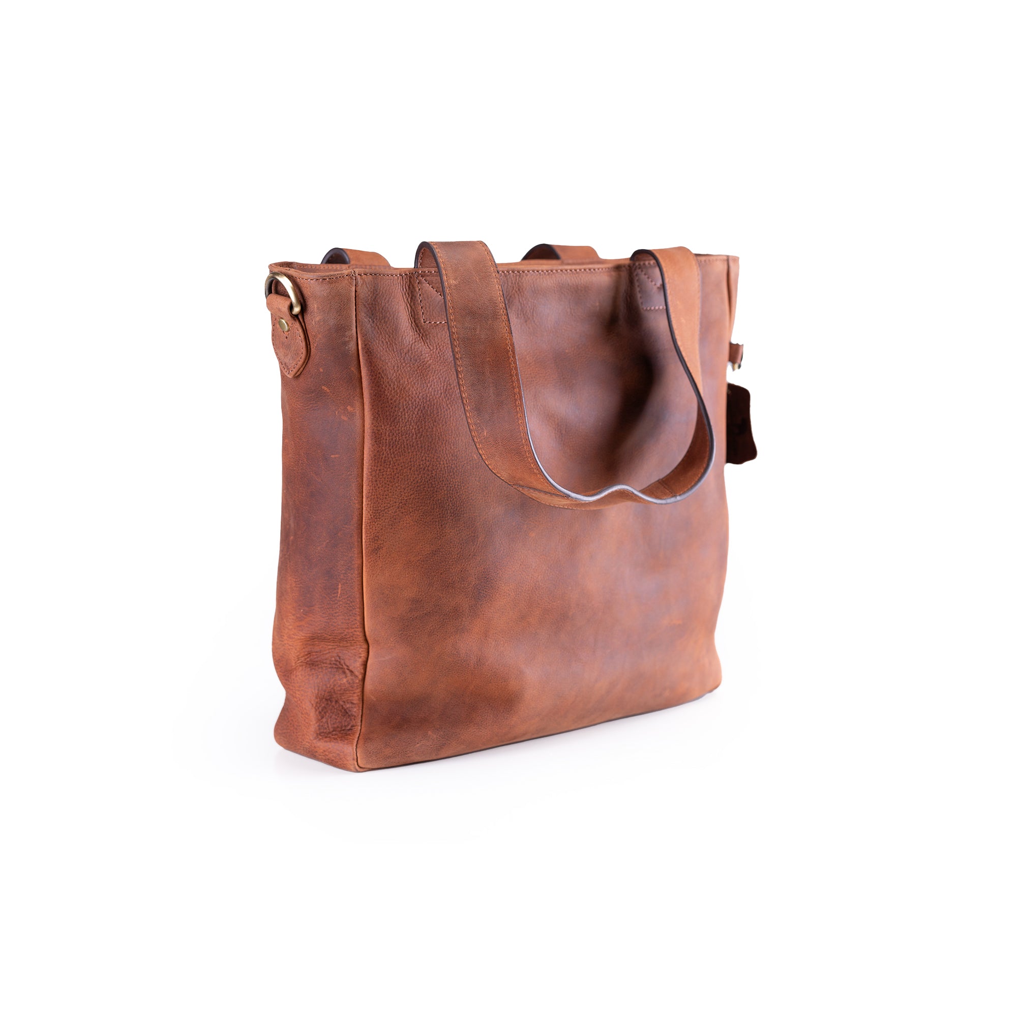 The Leather Work Tote Bag Parsley by Vintage Leather Sydney features a brown leather design with two handles, a minimalist look, and a slightly textured surface, blending timeless style and modern simplicity on a white background.